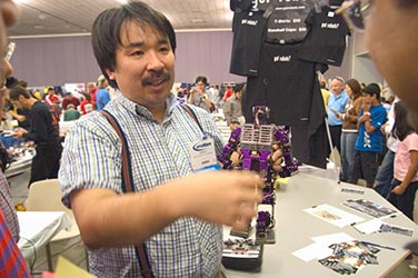 Jin Sato presenting his robots